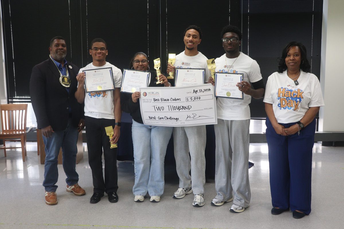 Team Black Coders holding certificates, trophies, and a $2,000 winner's check at the NextGen AI Innovation Challenge at Morgan State University