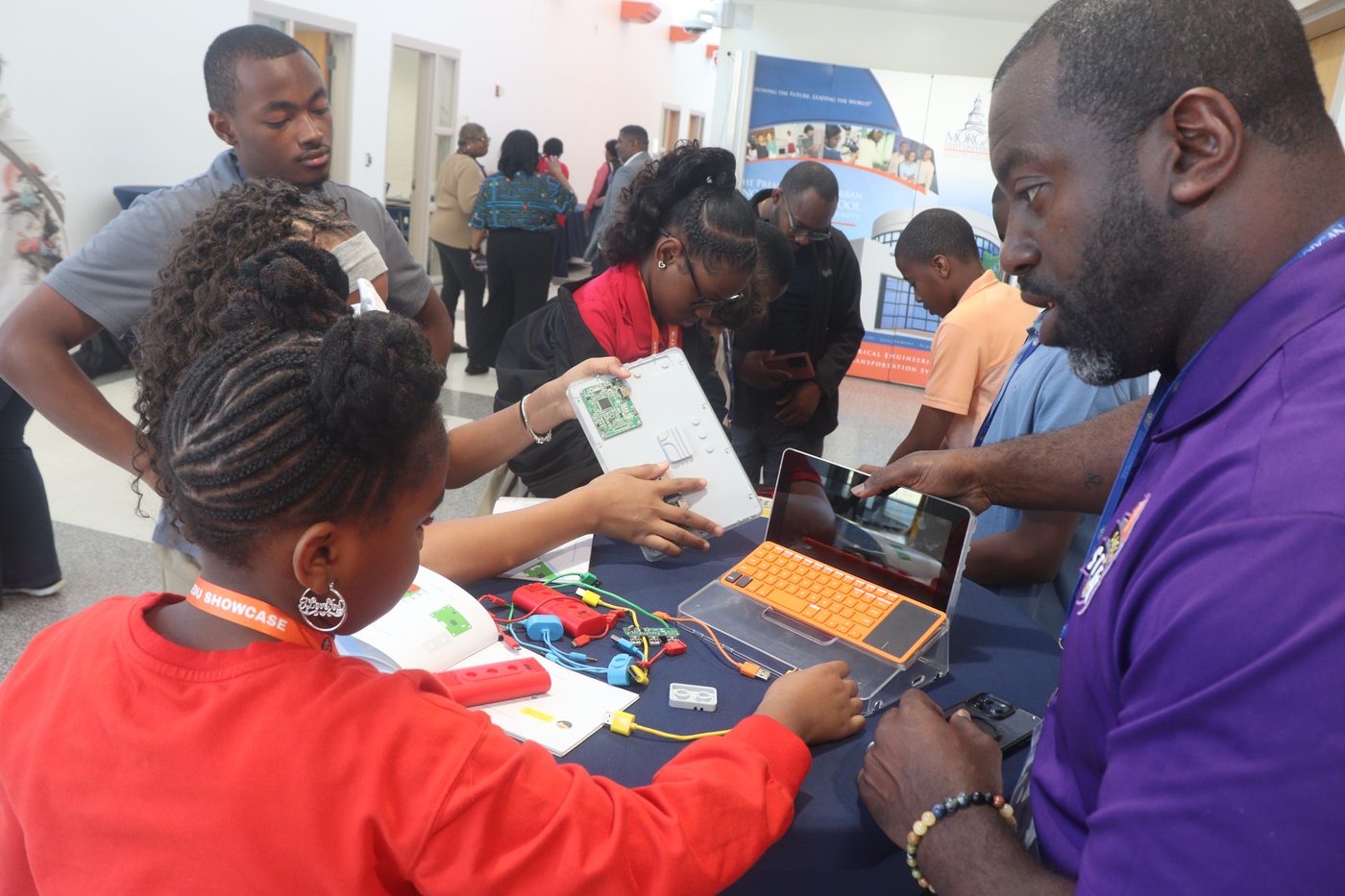 Students collaborating on AI projects with computer kits at a Morgan State University CEAMLS event